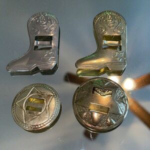 Four vintage western themed slotted concho slides‎
